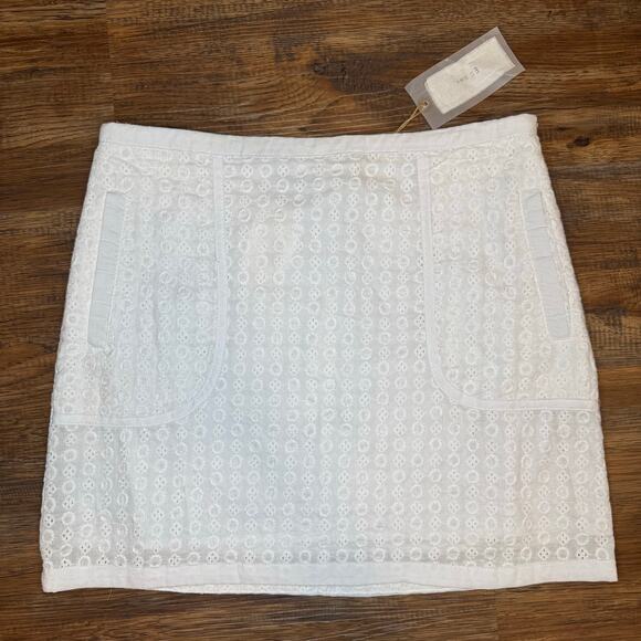 Esley Dresses & Skirts - Esley 100% Cotton white eyelet skirt size Medium mini skirt has pockets NWT